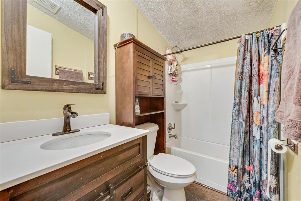 501 Billings Road Tolar, TX 76476 - Photo 11 of 22 a bathroom with a sink toilet and shower