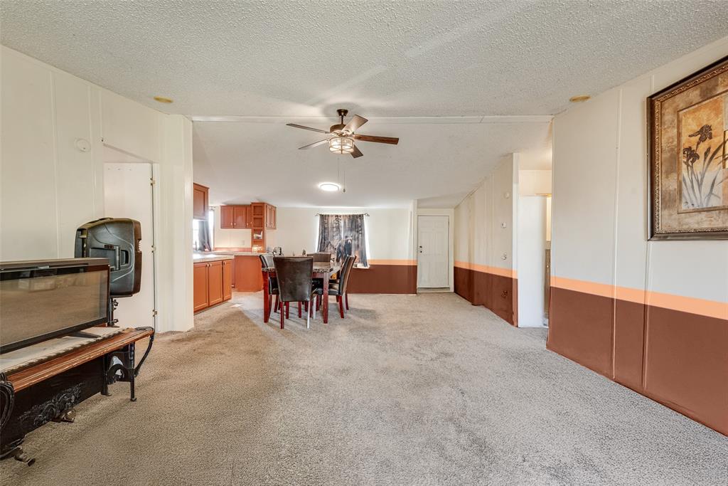 501 Billings Road Tolar, TX 76476 - Photo 3 of 22 a view of a livingroom with furniture and a ceiling fan