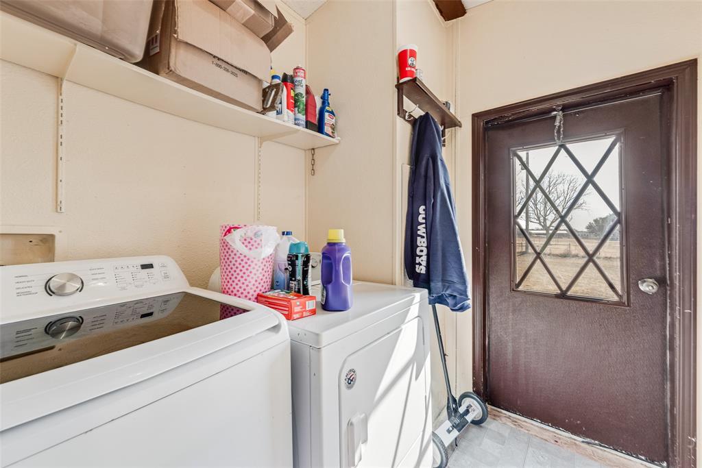 501 Billings Road Tolar, TX 76476 - Photo 9 of 22 a utility room with dryer and washer