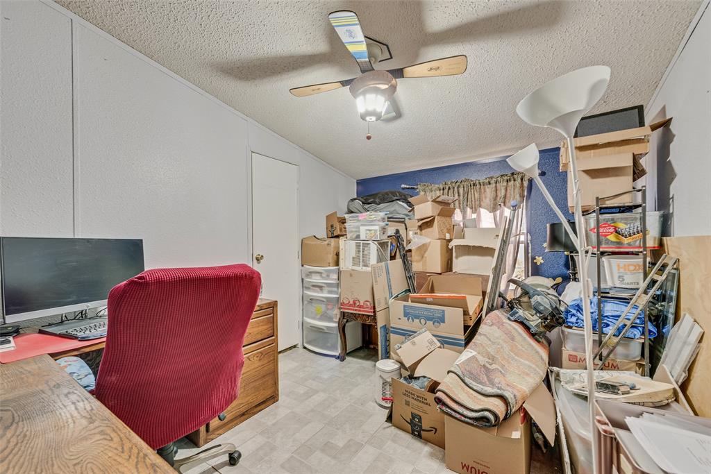 501 Billings Road Tolar, TX 76476 - Photo 10 of 22 a view of a livingroom with furniture and a fan