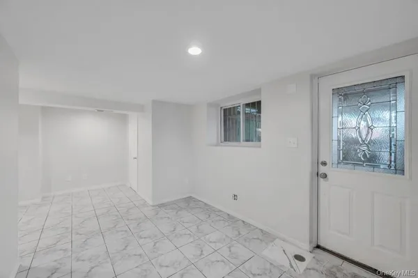 a view of an empty room and window
