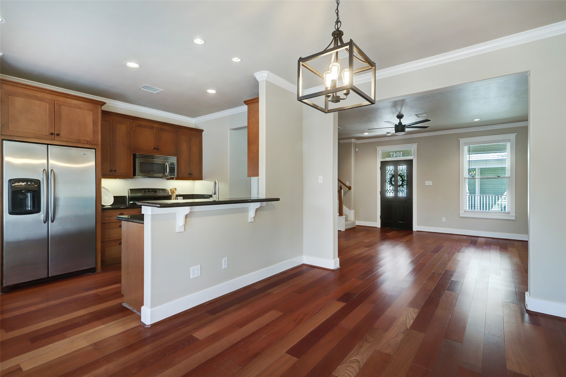 1047 West 16th Street Houston, TX 77008 - Photo 13 of 36 a kitchen with stainless steel appliances granite countertop a refrigerator a sink dishwasher a stove and a refrigerator with wooden floor