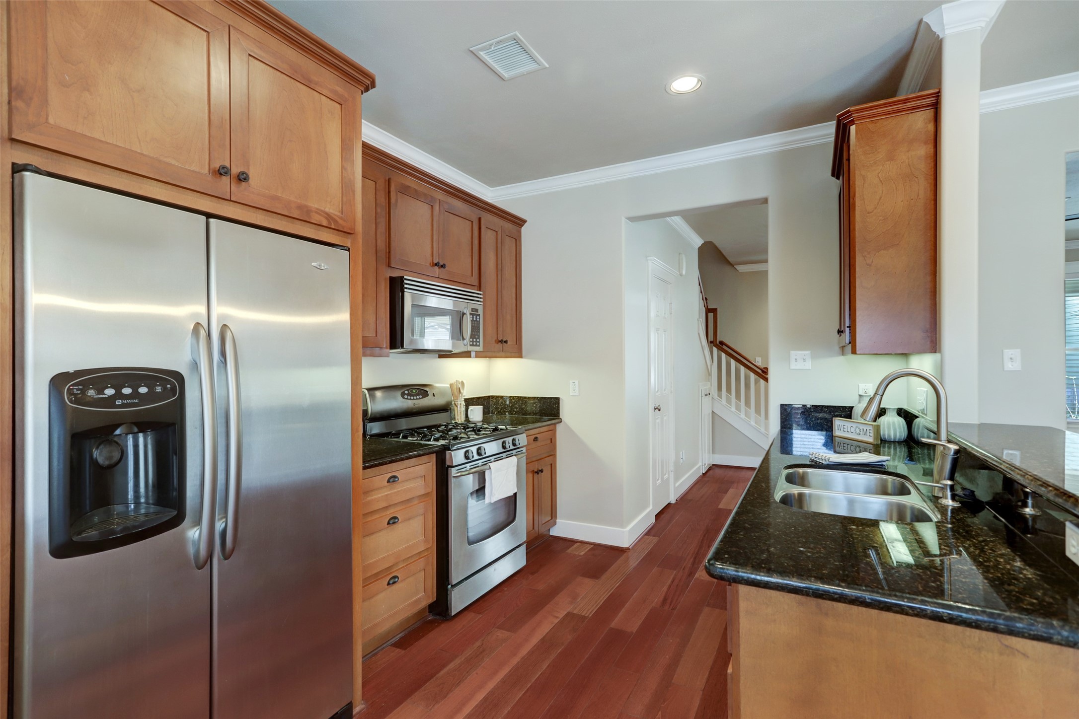 1047 West 16th Street Houston, TX 77008 - Photo 14 of 36 a kitchen with granite countertop a refrigerator stove and sink