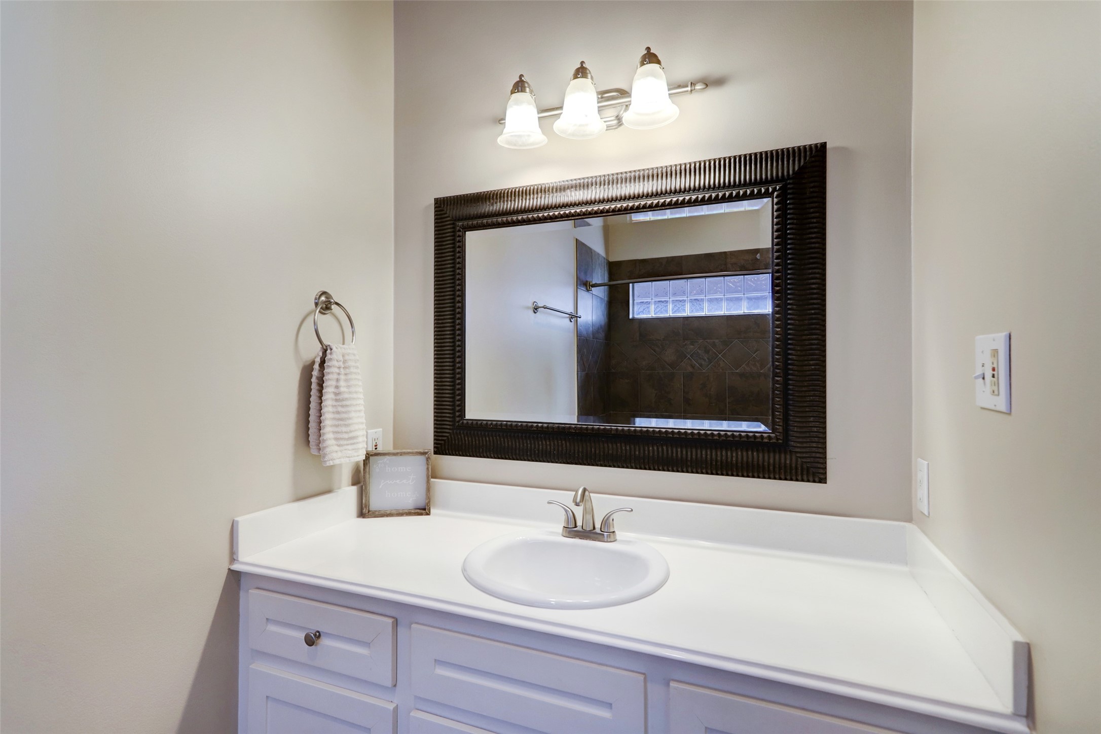 1047 West 16th Street Houston, TX 77008 - Photo 21 of 36 a bathroom with a sink and a mirror