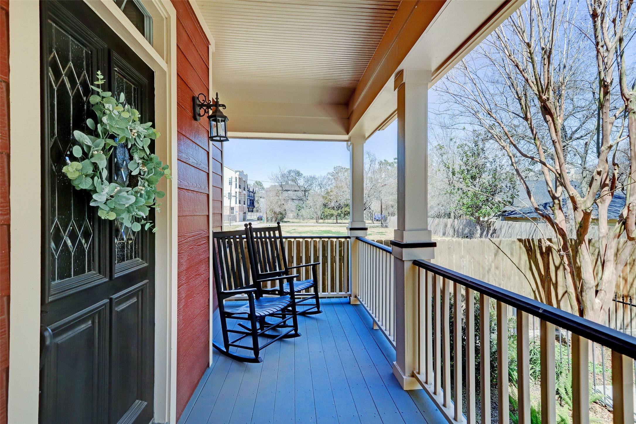 1047 West 16th Street Houston, TX 77008 - Photo 8 of 36 a view of a balcony with chairs and wooden fence