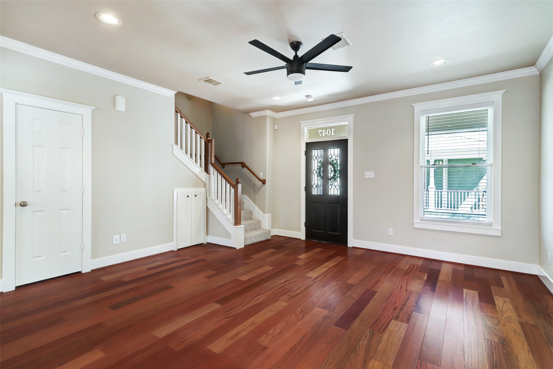 1047 West 16th Street Houston, TX 77008 - Photo 10 of 36 a view of empty room with wooden floor and fan