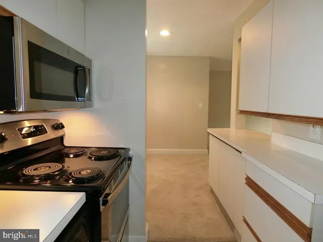 a kitchen with a stove and a microwave