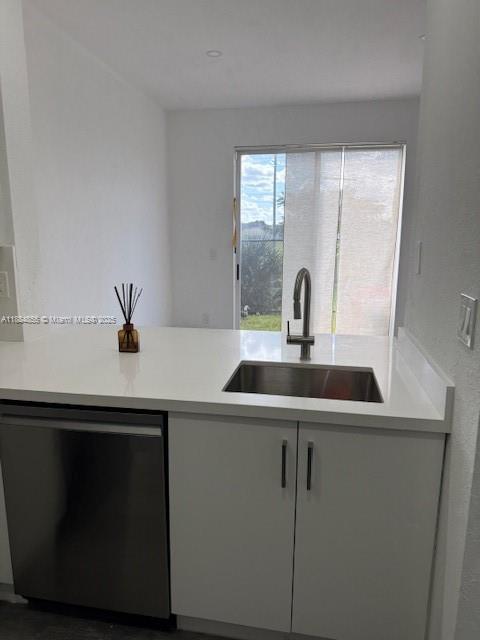 17820 Northwest 73rd Avenue, Unit 1011 Hialeah, FL 33015 - Photo 14 of 22 a kitchen with a sink and a window