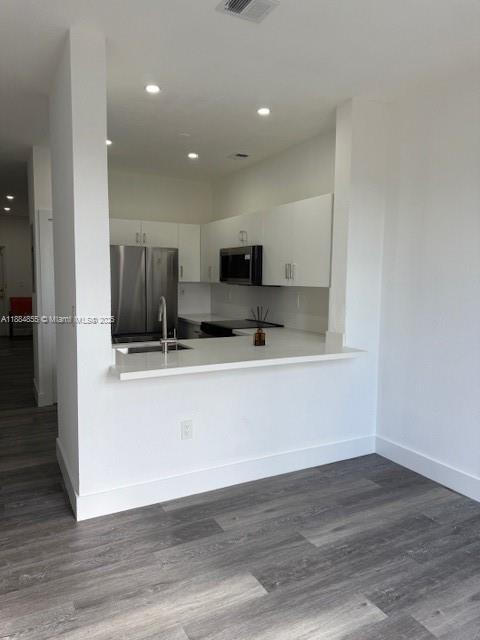 17820 Northwest 73rd Avenue, Unit 1011 Hialeah, FL 33015 - Photo 17 of 22 a view of kitchen with stainless steel appliances refrigerator stove microwave and cabinets