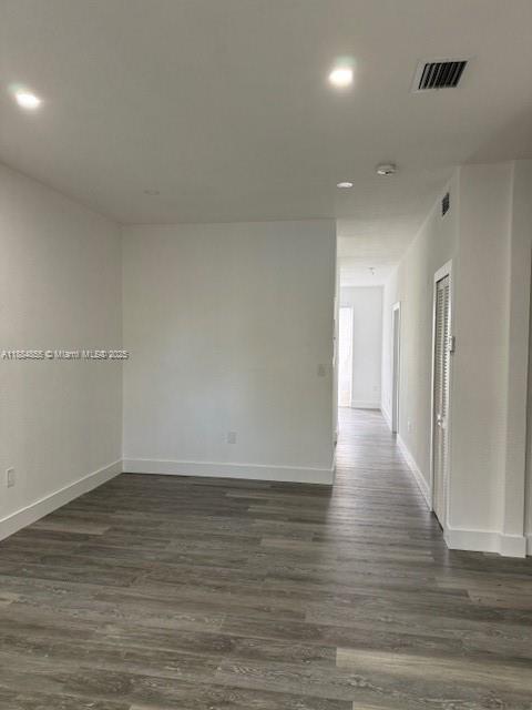 17820 Northwest 73rd Avenue, Unit 1011 Hialeah, FL 33015 - Photo 2 of 22 a view of an empty room with wooden floor