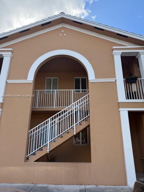 17820 Northwest 73rd Avenue, Unit 1011 Hialeah, FL 33015 - Photo 22 of 22 a view of entryway with stairs