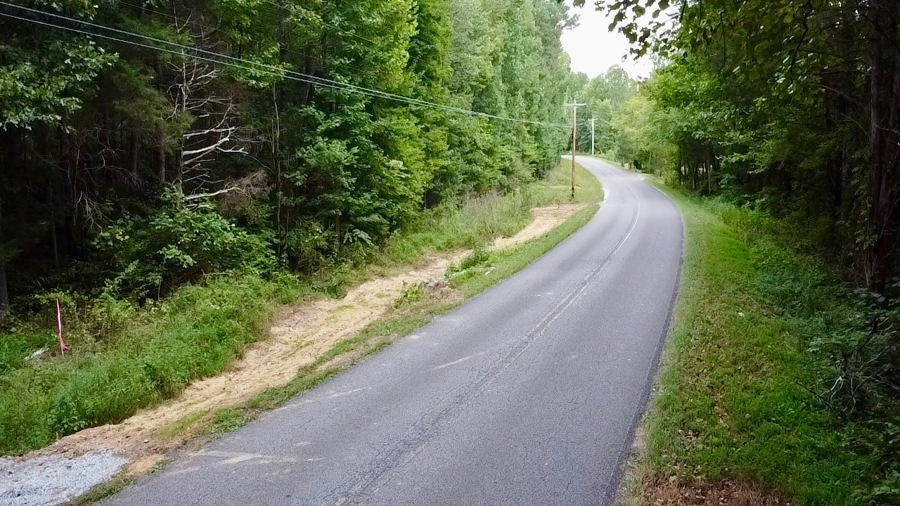 8 Sales Landing Road Camden, TN 38320 - Photo 21 of 31 a view of a road with a yard and a fountain