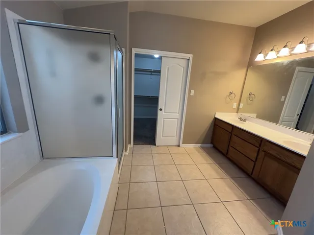 a bathroom with a sink and mirror