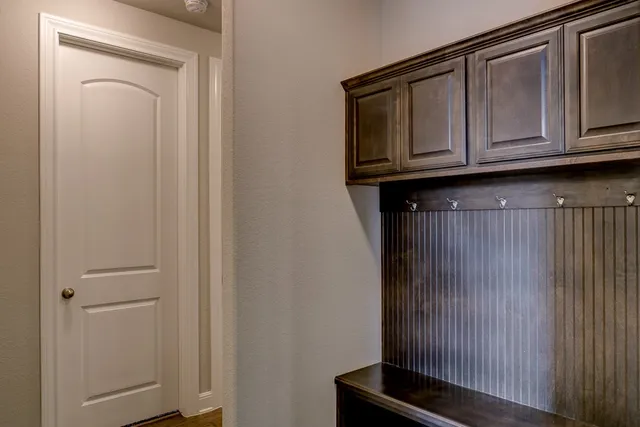 a view of cabinets and wooden floor