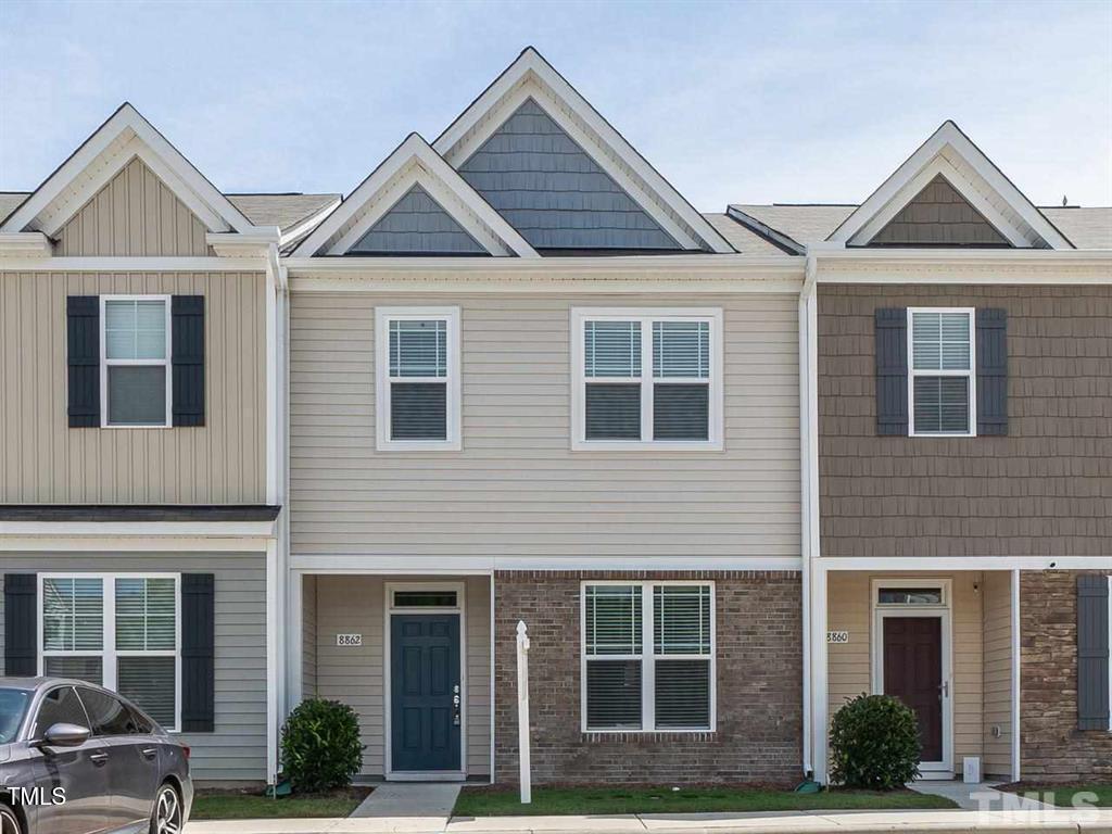 8862 Common Townes Drive Raleigh, NC 27616 - Photo 13 of 13 a front view of a house with garden