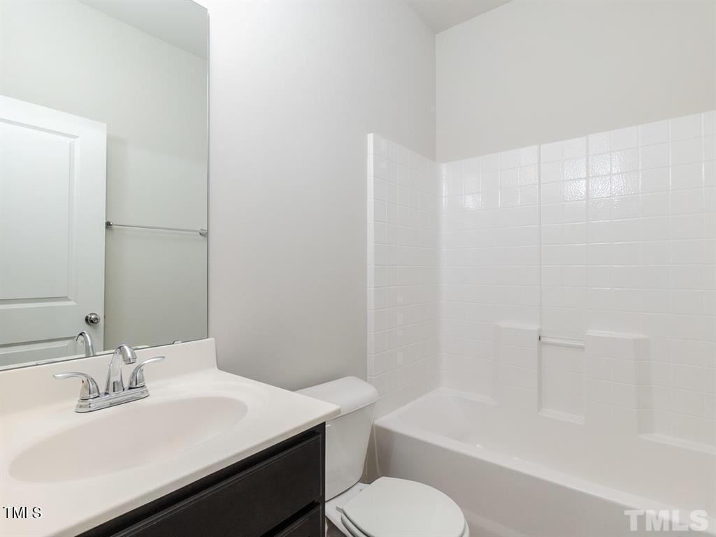 8862 Common Townes Drive Raleigh, NC 27616 - Photo 7 of 13 a bathroom with a sink toilet and shower