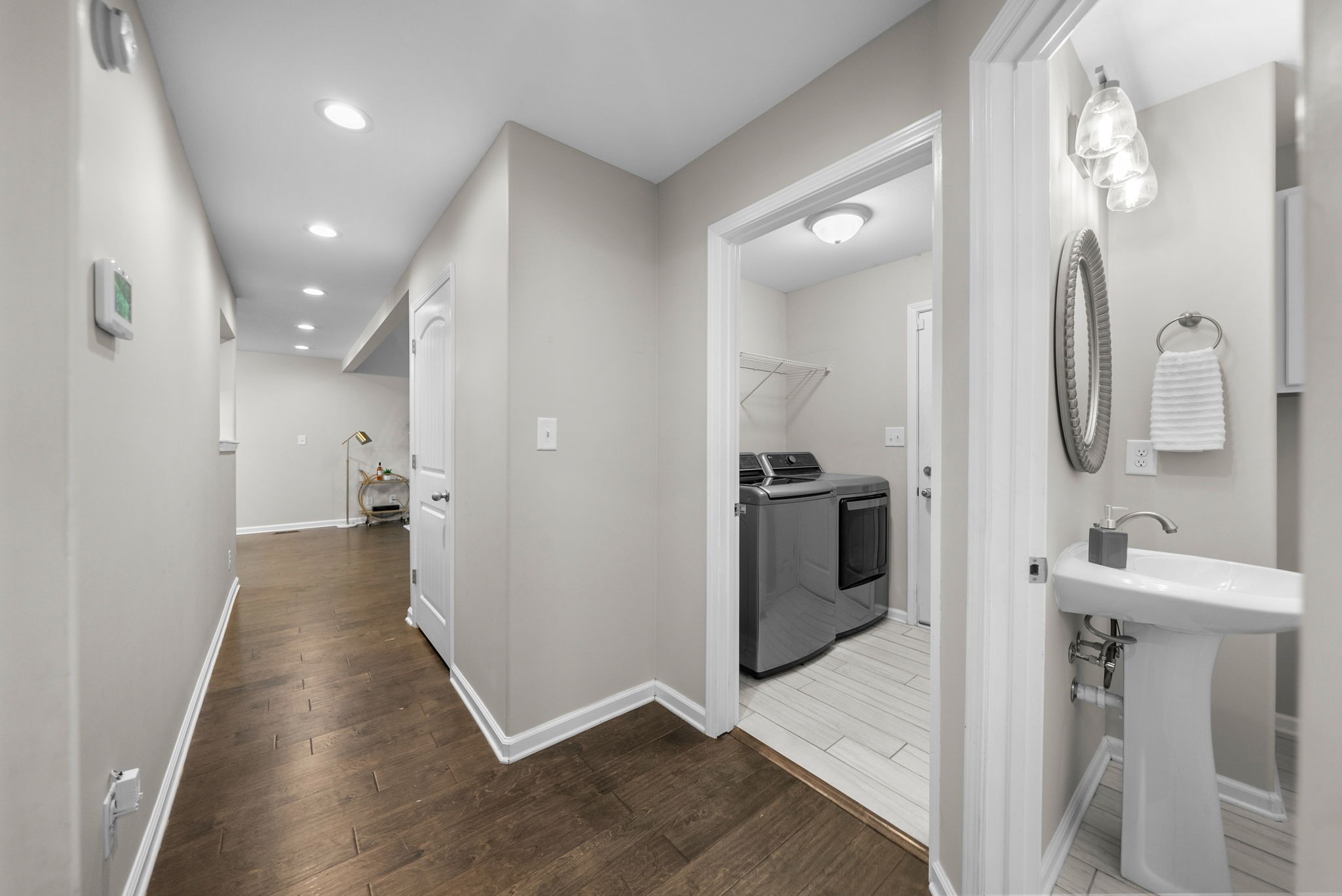 2685 Mockingbird Hill Road Palmyra, TN 37142 - Photo 20 of 47 a view of a hallway with wooden floor and a bathroom