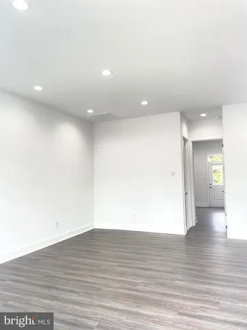 a kitchen with stainless steel appliances a stove a sink and a refrigerator