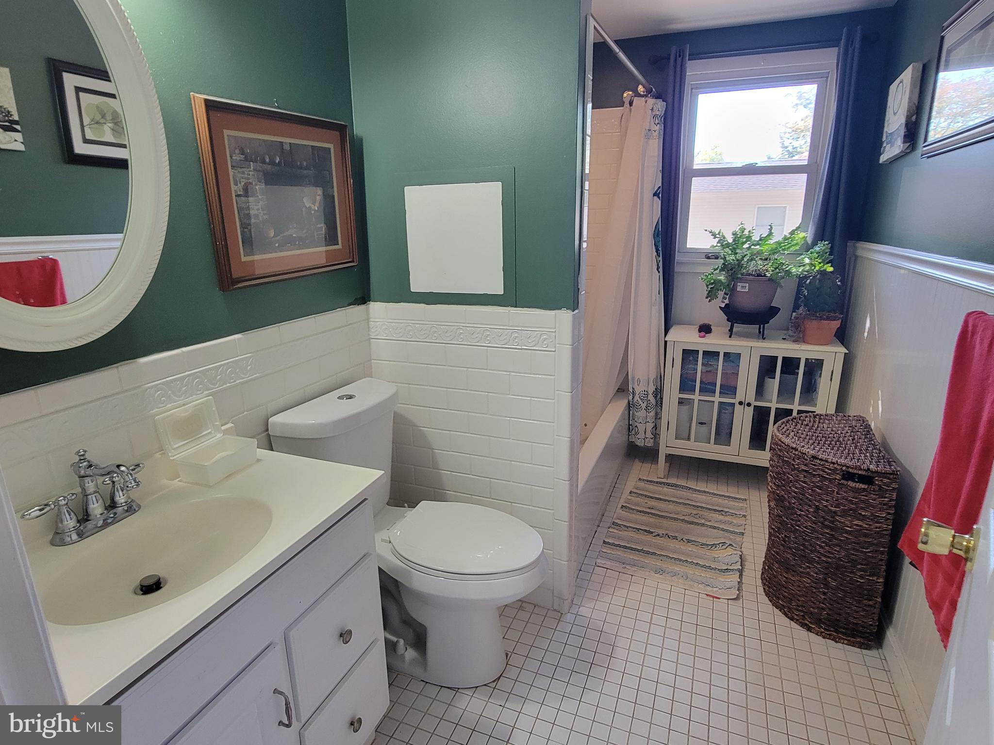 111 McKee Road Gibbsboro, NJ 08026 - Photo 36 of 62 a bathroom with a toilet a sink and a mirror