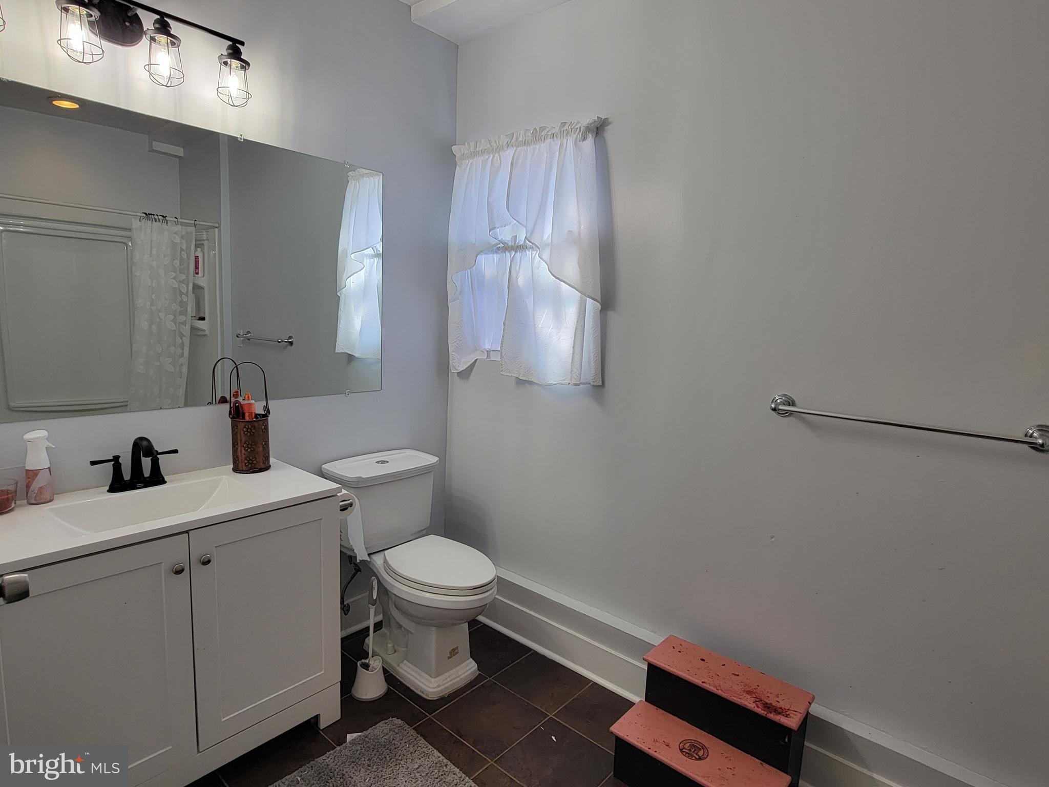 111 McKee Road Gibbsboro, NJ 08026 - Photo 57 of 62 a bathroom with a toilet sink and mirror