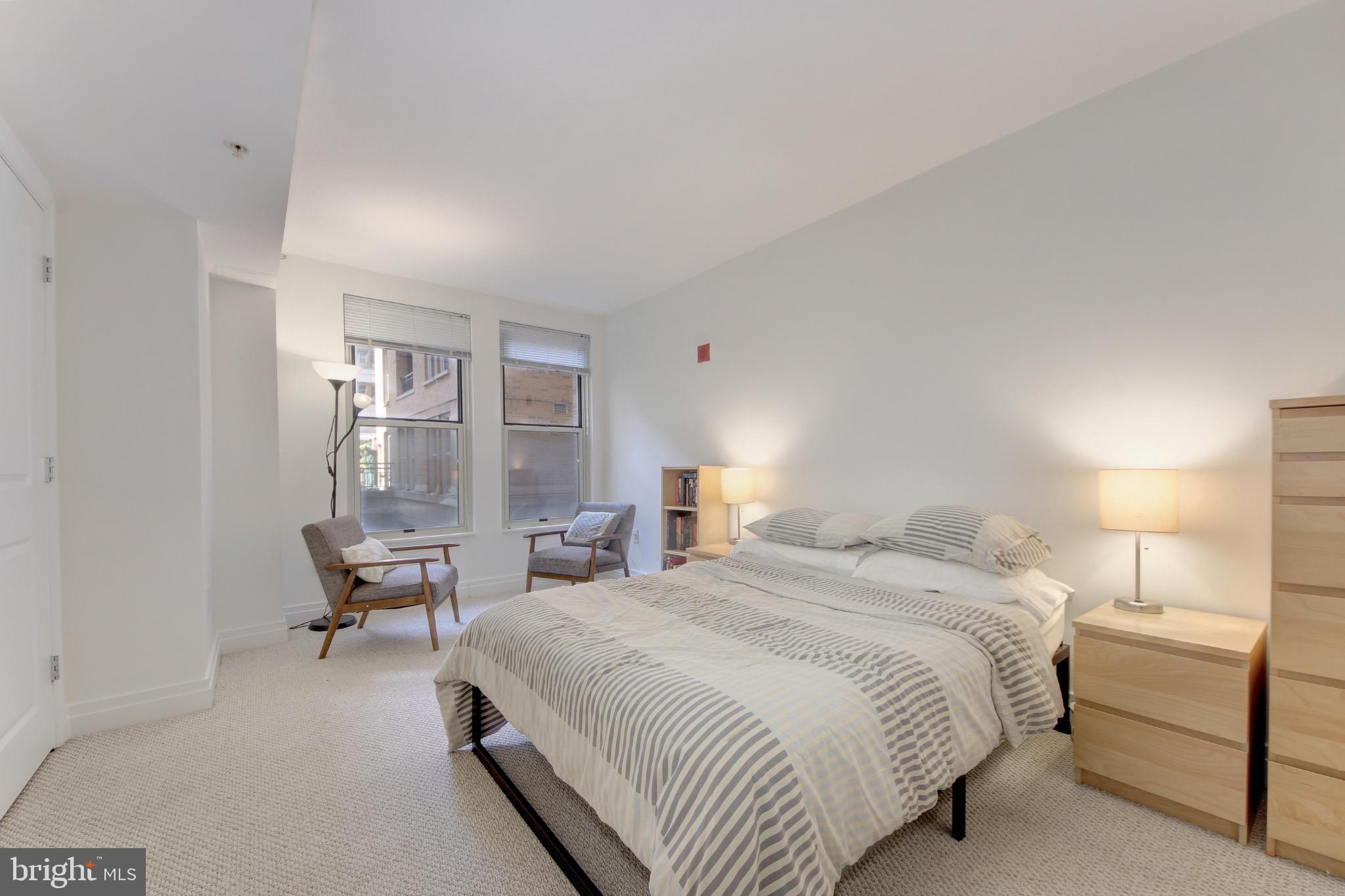 915 E Street Northwest, Unit 505 Washington, DC 20004 - Photo 13 of 35 Serene bedroom with natural light.