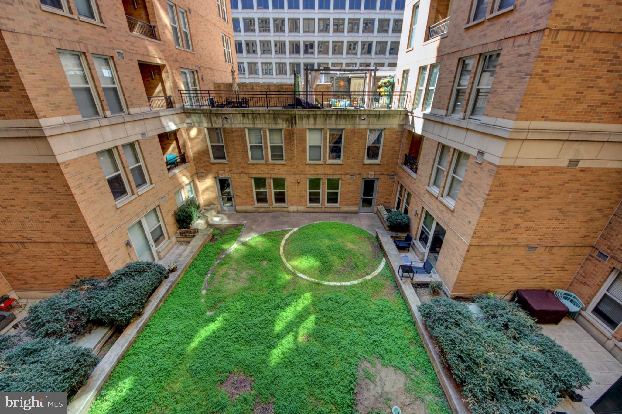 915 E Street Northwest, Unit 505 Washington, DC 20004 - Photo 21 of 35 Building offers charming landscaped courtyard
