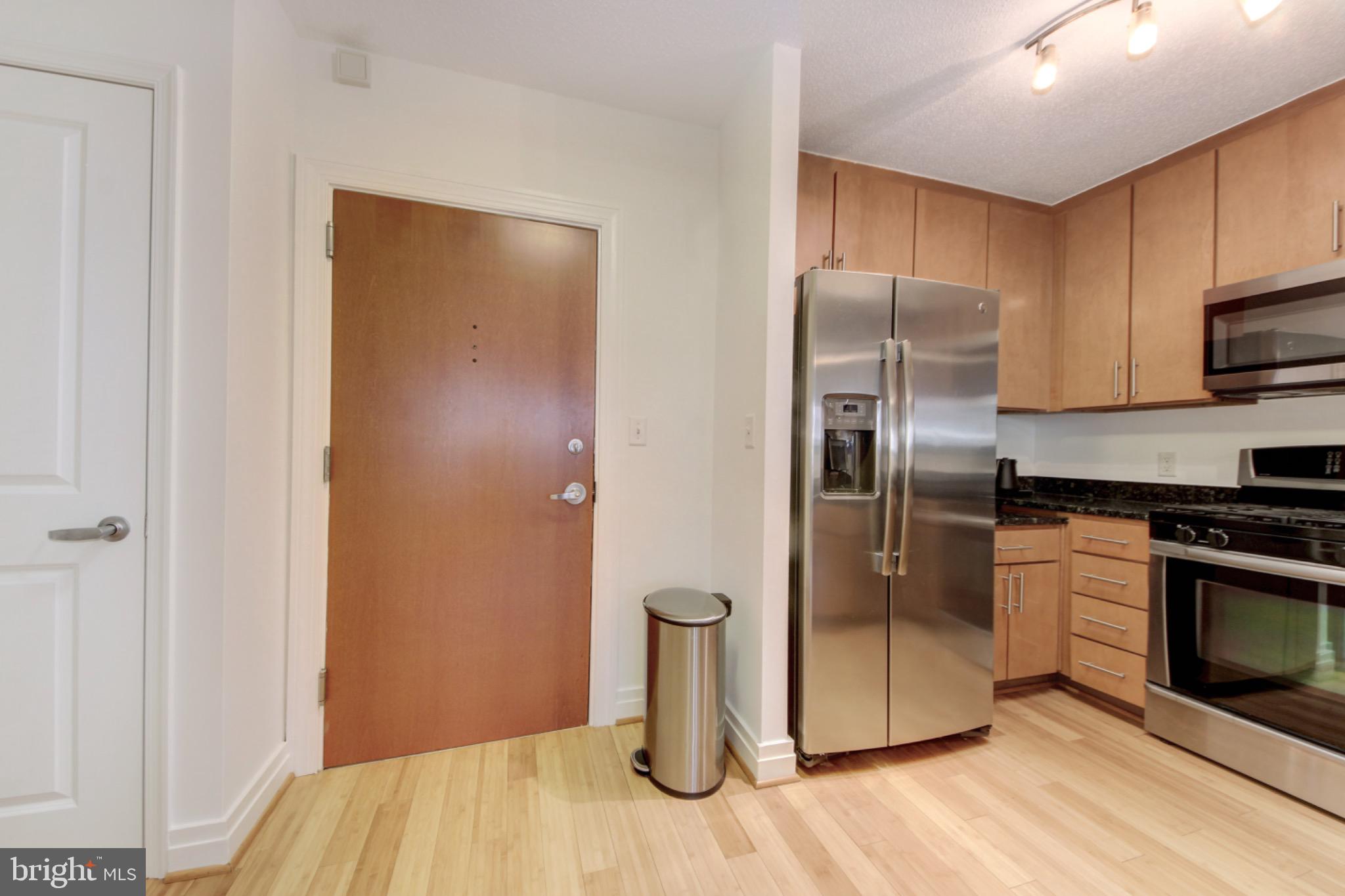 915 E Street Northwest, Unit 505 Washington, DC 20004 - Photo 4 of 35 Kitchen and coat closet located just off entrance