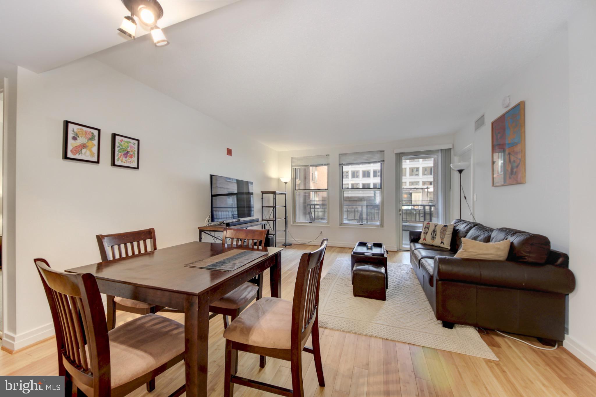 915 E Street Northwest, Unit 505 Washington, DC 20004 - Photo 7 of 35 Large windows and door to balcony make home bright