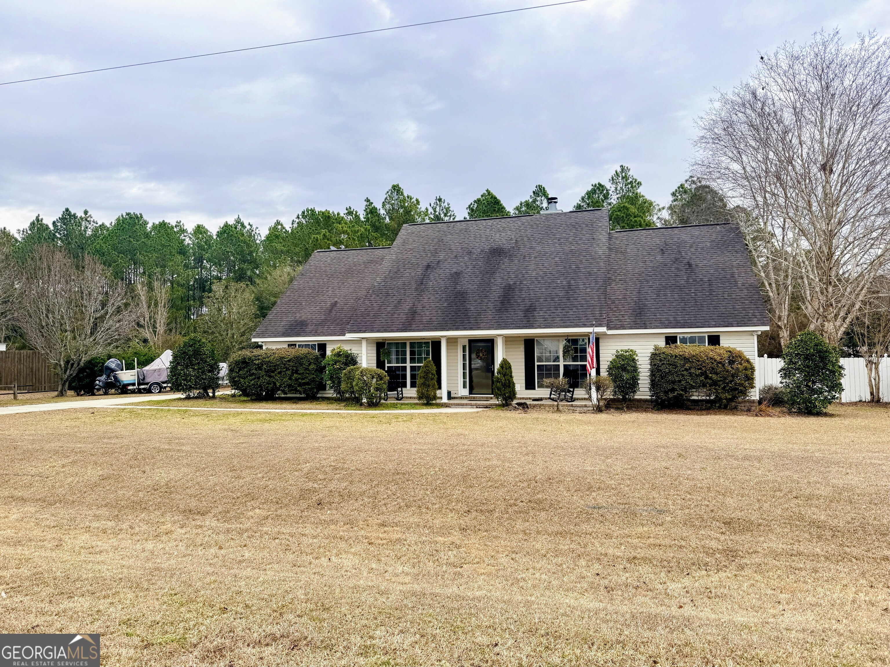 a front view of house with yard and green space