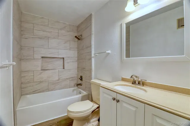 a bathroom with a sink a toilet and a bathtub