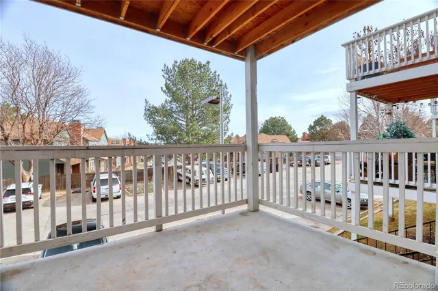 a view of a porch with wooden floor
