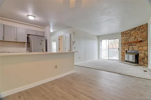 a view of a kitchen with a sink and a stove top oven