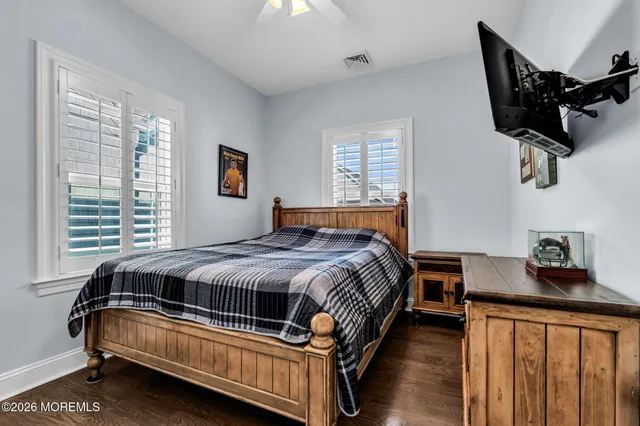 a bedroom with a bed and dresser