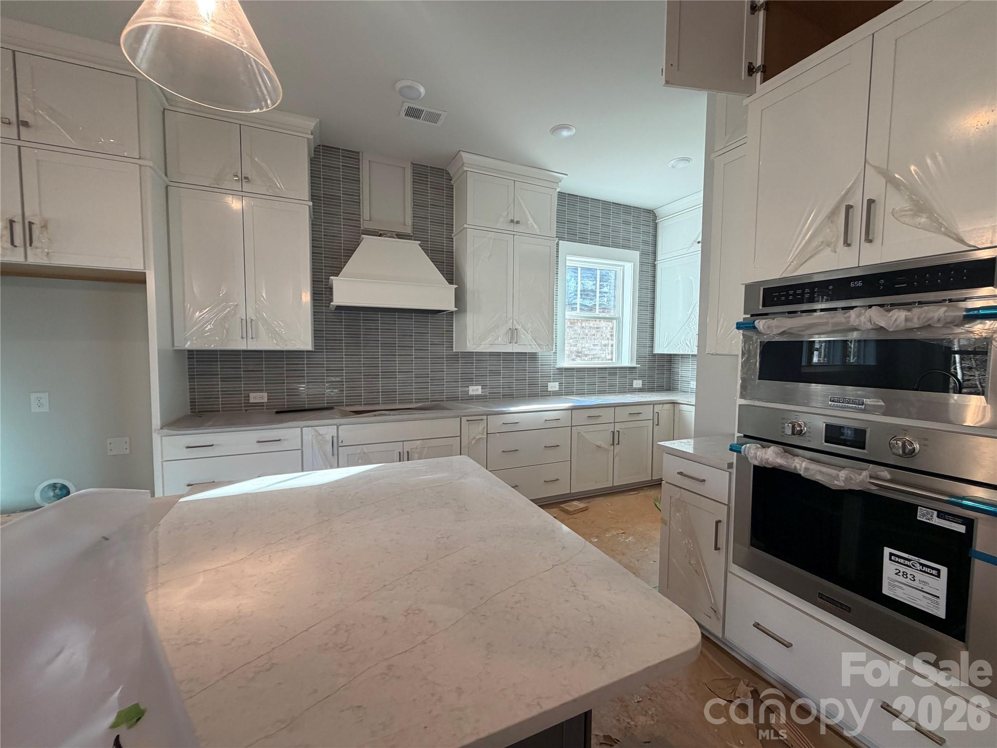 5015 Holw Br Road Charlotte, NC 28278 - Photo 3 of 7 a large kitchen with stainless steel appliances granite countertop a stove a sink and a microwave