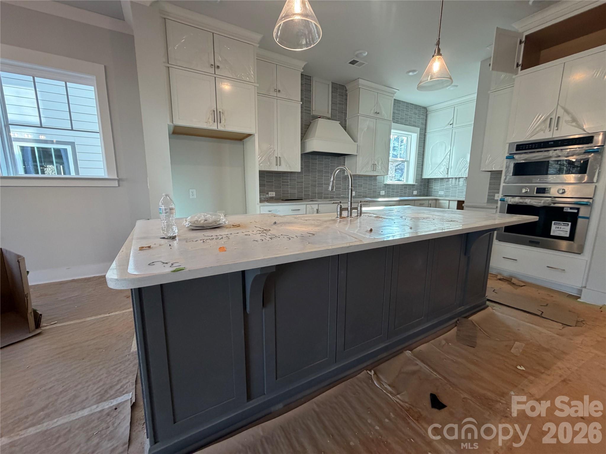 5015 Holw Br Road Charlotte, NC 28278 - Photo 4 of 7 a kitchen with stainless steel appliances a sink stove and cabinets