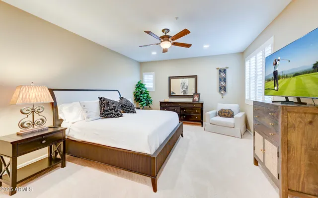 a dining room with furniture a chandelier and window