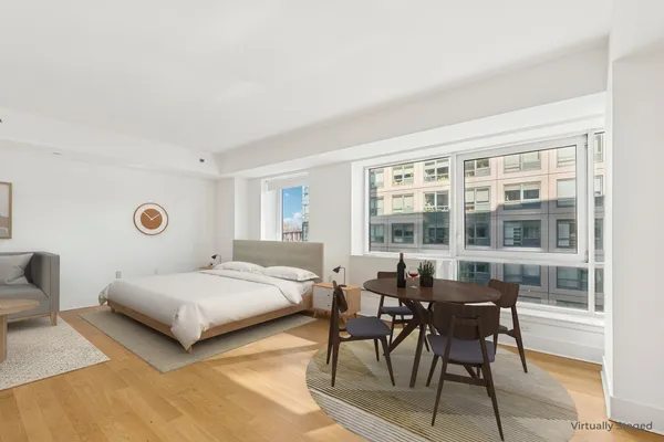 a bedroom with a bed and a table in it
