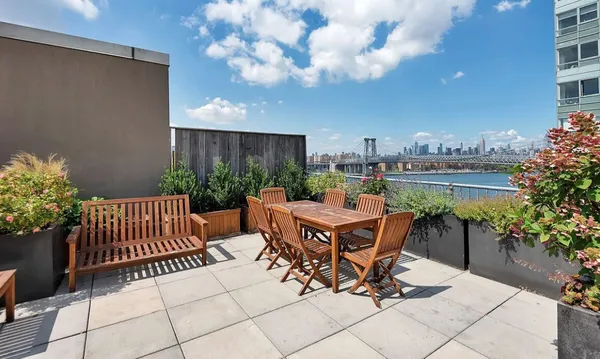 a outdoor dining space with furniture and garden view
