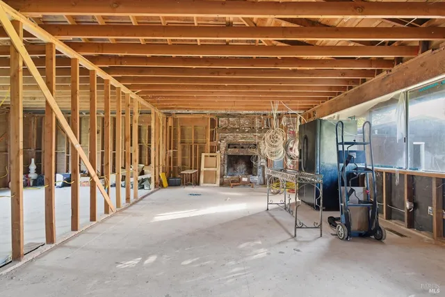 a view of a patio with table and chairs