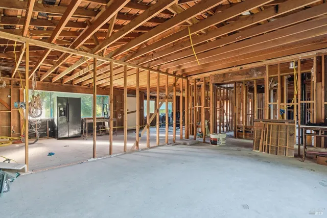 a view of an empty room with glass door