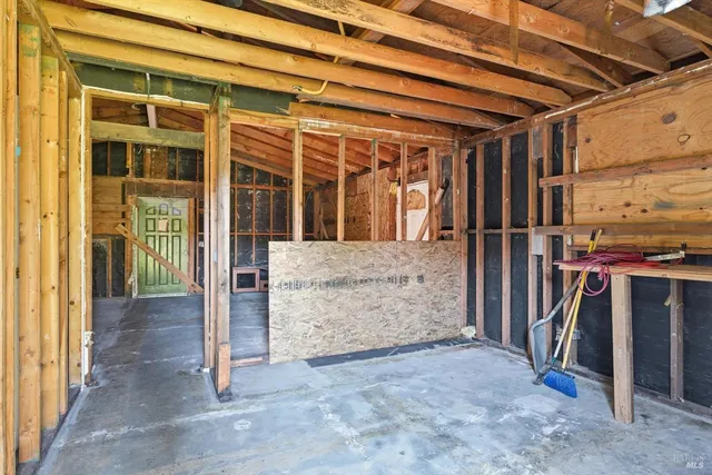 a view of a porch with a wooden door