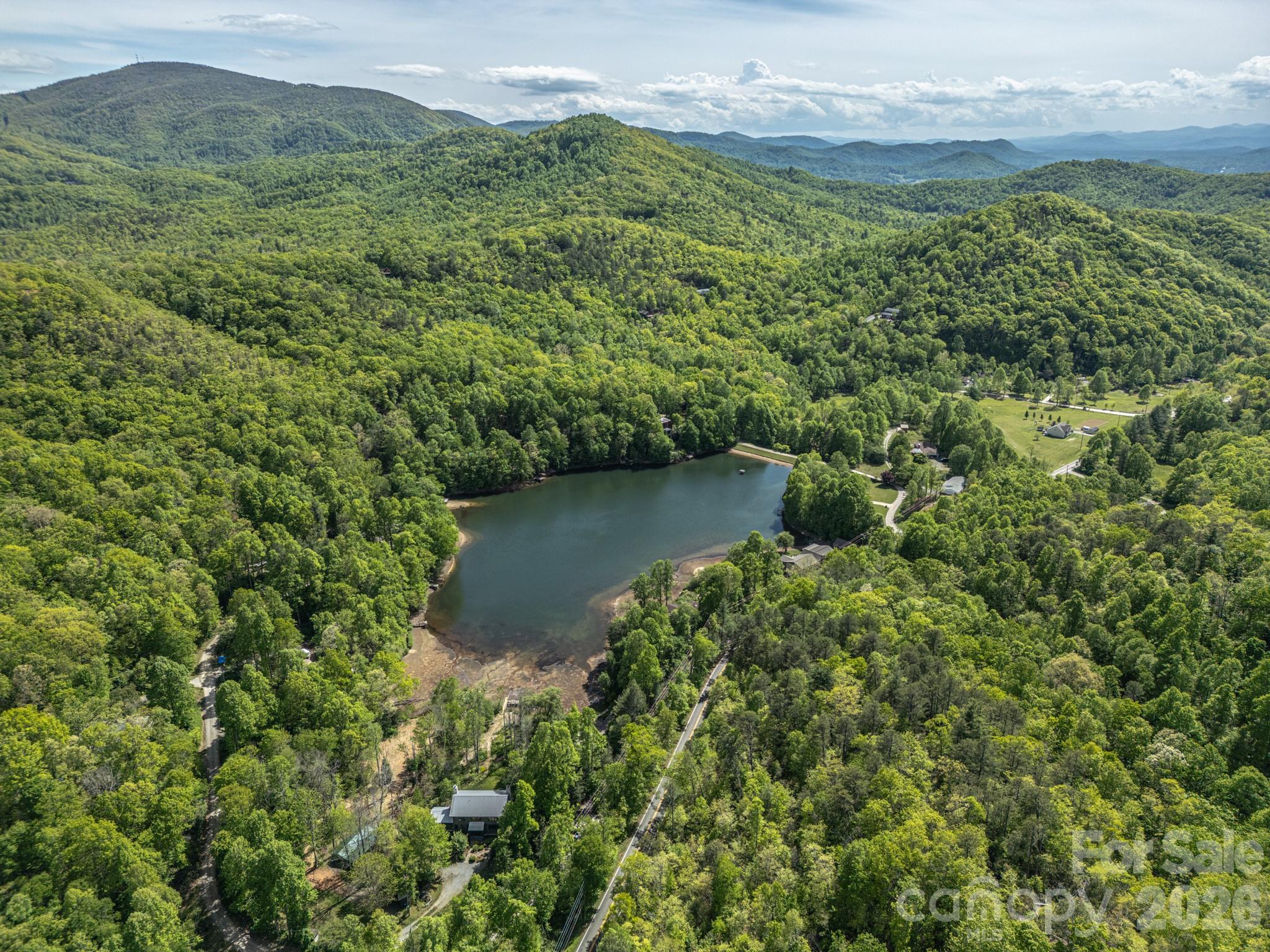 10.1-acres On Old Fort Road Fairview, NC 28730 - Photo 6 of 28 a view of a lake with a mountain in the background