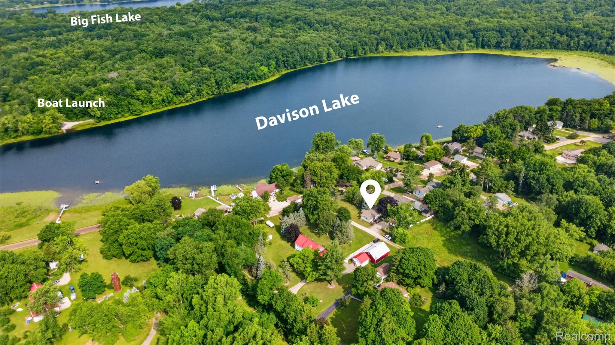 5977 Anglers Road Ortonville, MI 48462 - Photo 48 of 63 Aerial perspective showcasing Davison Lake with surrounding residential properties and abundant tree cover