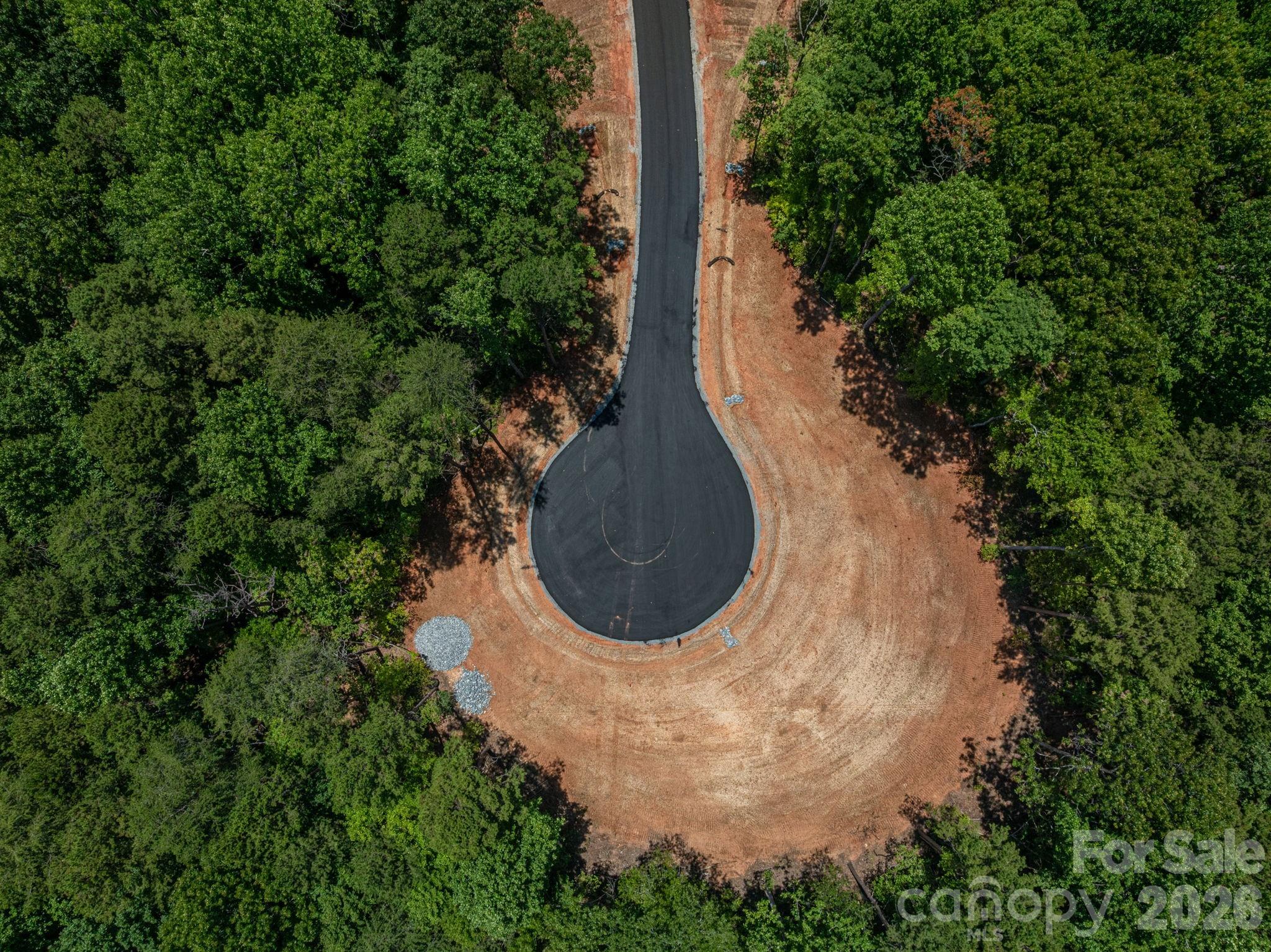 0 Oak Hill, Unit 13B Denver, NC 28037 - Photo 6 of 14 an aerial view of a house with a yard and trees all around