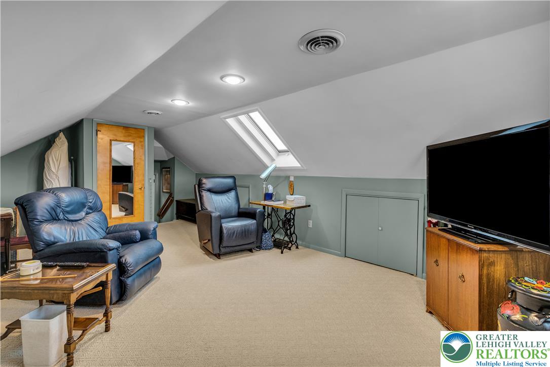 2750 Belaire Road Bethlehem, PA 18017 - Photo 37 of 56 Slanted ceilings and a bright skylight define this comfortable carpeted upper-level bonus space.