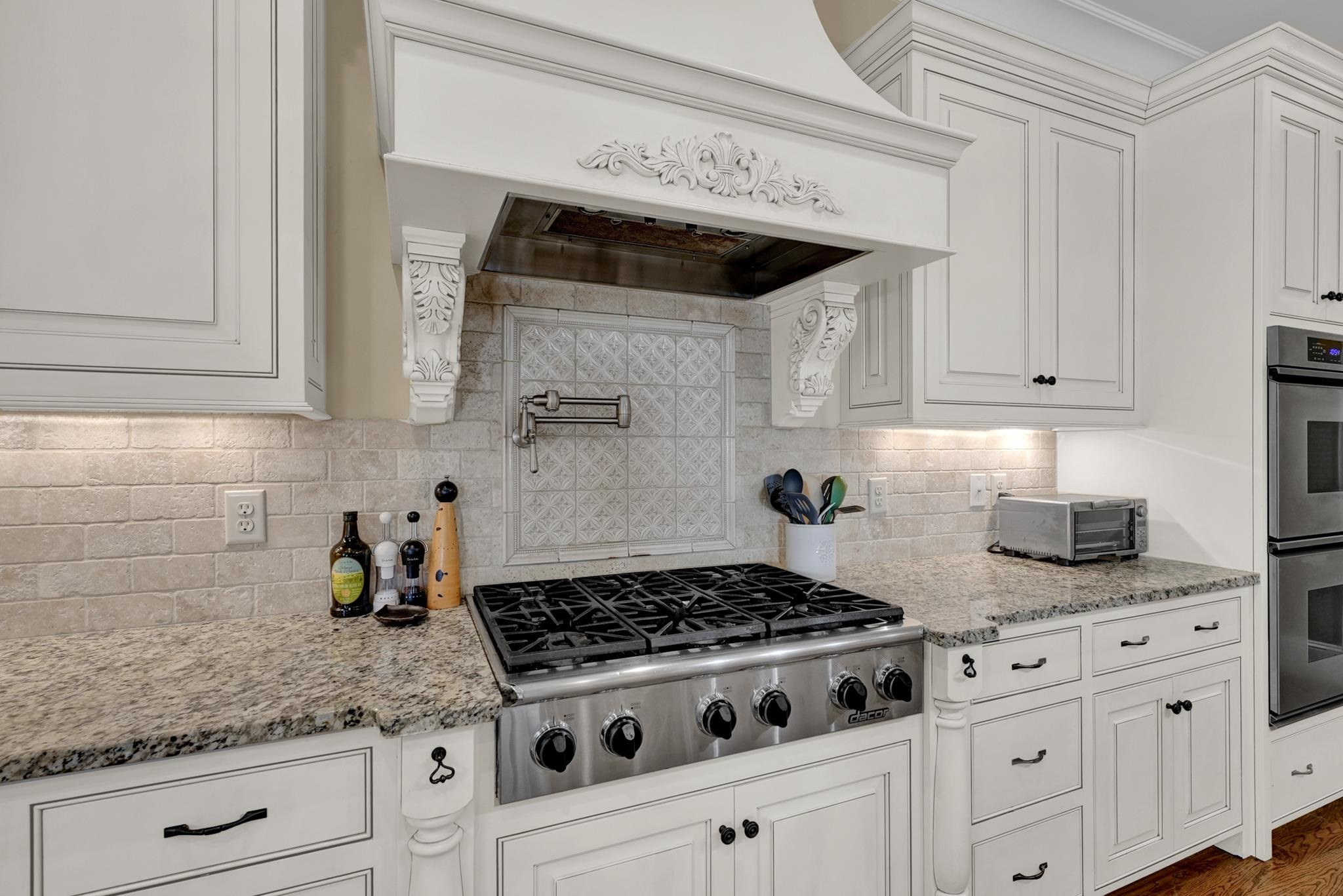 2229 Coley Forest Place Raleigh, NC 27607 - Photo 8 of 45 Dacor 6 Burner Gas Cooktop. Pot Filler over Cooktop Kitchen