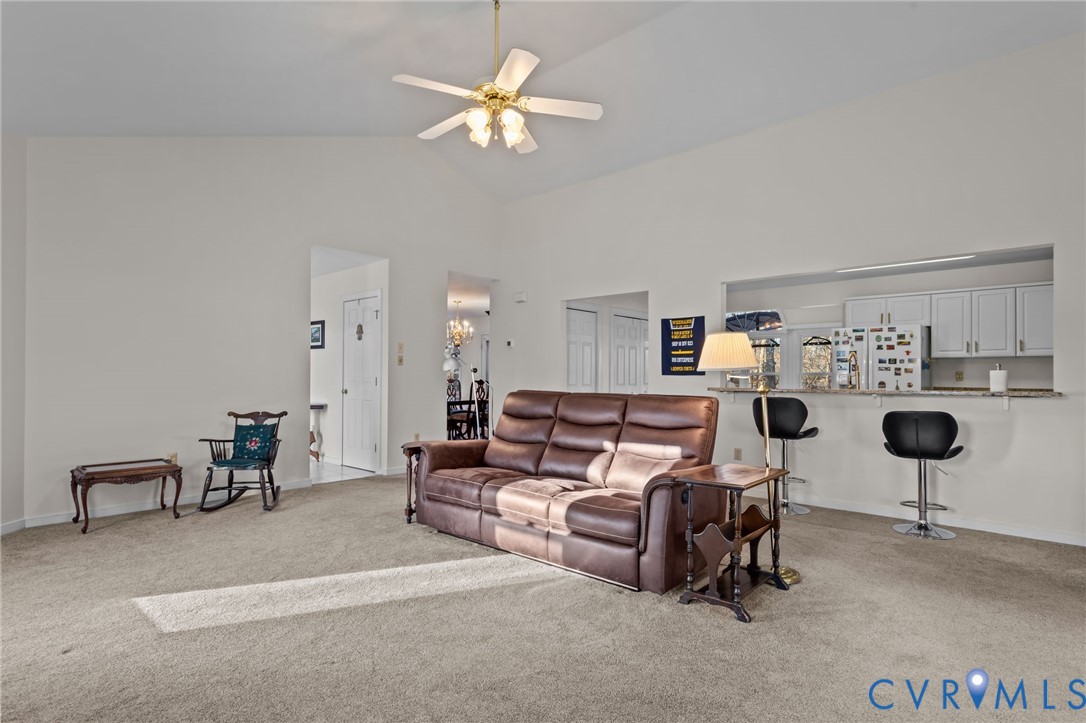 518 Rebel Ridge Road Colonial Heights, VA 23834 - Photo 12 of 44 a living room with furniture and a chandelier