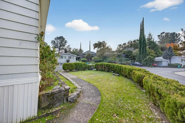 a kitchen with stainless steel appliances kitchen island granite countertop a sink stove and cabinets