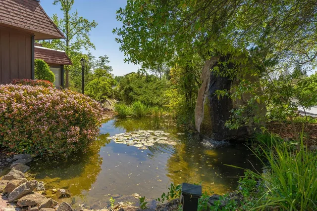 an aerial view of a house with a garden