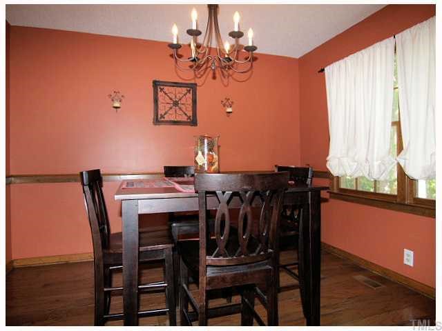 6228 Lookout Loop Raleigh, NC 27612 - Photo 5 of 10 a view of a dining room with furniture and window